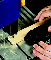 Another similar feature is a plastic and aluminum miter gauge.