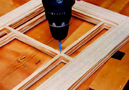 The rear grid serves as a retainer for the translucent screen material and needs to be fastened to the front grid with brass screws. Bore pilot holes and countersinks for the screws in the four intersections inside the grid.