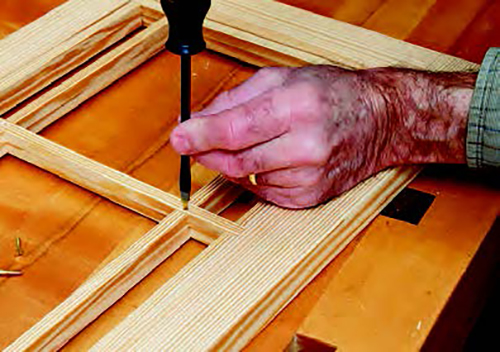 Next, install the brass screws in each hole to set the threads. You might want to use steel screws of the same size because they're less likely to break.