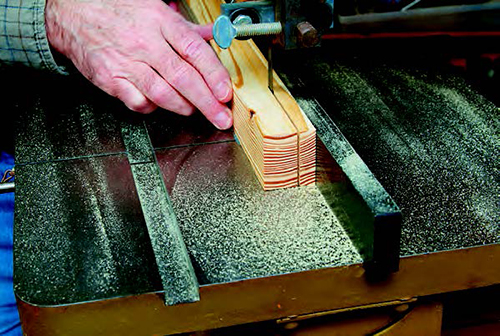 To use a band saw to make the 3/8”-square lattice strips, rip pieces slightly less than 1/2” wide from larger stock. (The piece shown is roughly 2 x 2