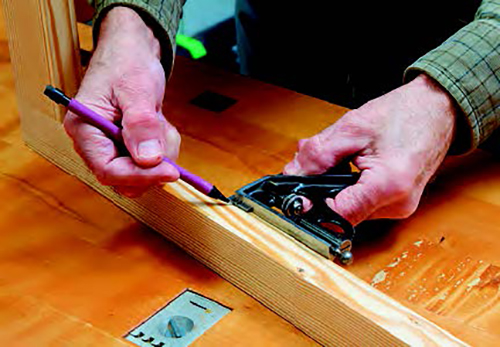 The inward facing lattice grid (the side that faces into the room) is permanently attached to the frame. Establish the grid's 1/8-inch setback with a combination square and pencil.