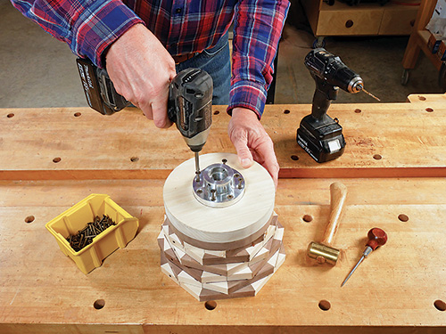 Screwing faceplate into segmented bowl turning blank