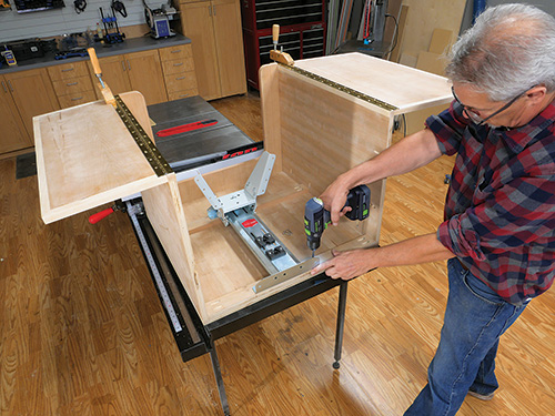 Installing sewing machine lift in cabinet