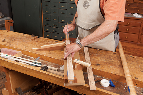 Marking work chair leg using a story stick and an alignment ramp