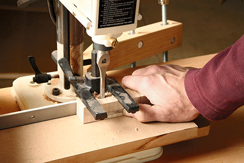 Chopping mortises in Shaker end table legs with a mortising machine