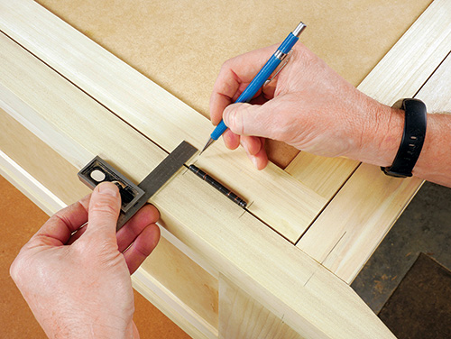 Marking hinge location on Shaker cabinet legs