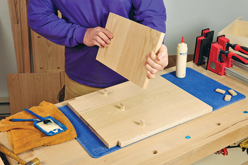 Attaching shelf to storage bench side panel