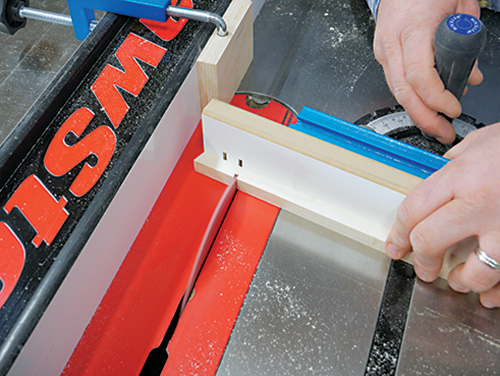 Using step-off block to guide lamp shade frame cut