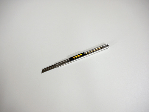 Snap blade knife used to trim rice paper