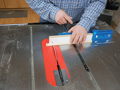 Using flip stop on miter gauge to guide lamp shade frame cut