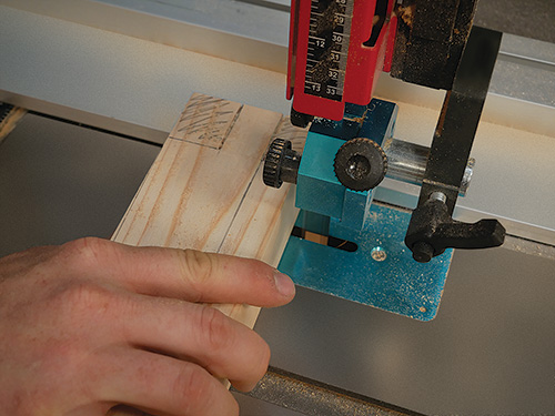 Using band saw to cut table leg joinery