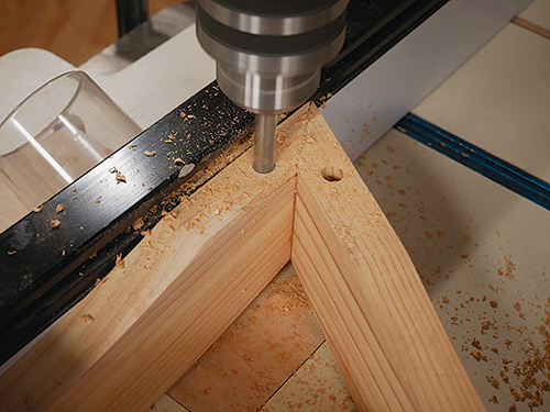 Cutting out hole for installing dowel in table apron