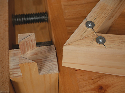 Metal dowels installed in patio table apron