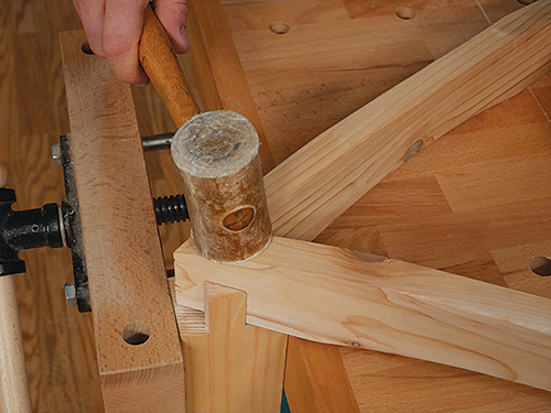 Test fitting table legs and apron joint with mallet