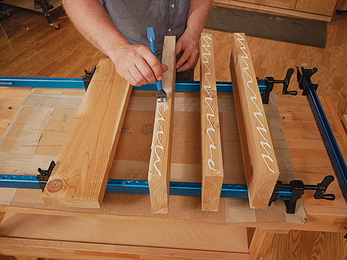 Gluing cedar panels together to create tabletop