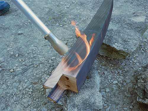 Burning table legs for patio table finish