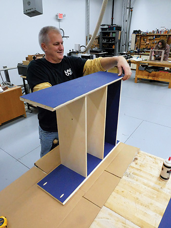 Setting side panel in place for simple bookcase