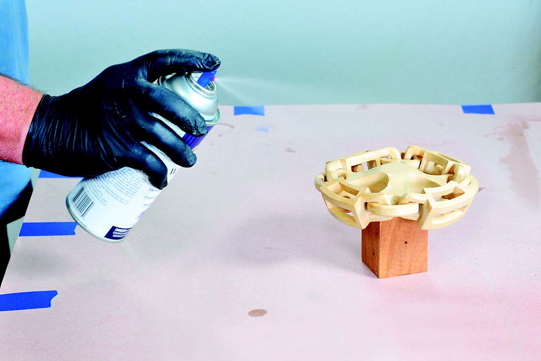 It would be difficult to wipe a finish onto this ball-in-chain carving. Lacquer sprayed from an aerosol can, however, was ideal.