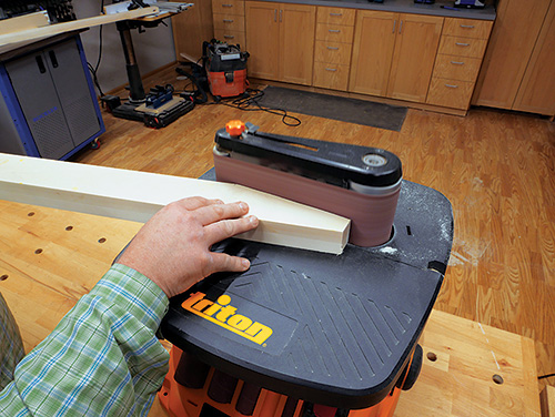 Sanding smooth the supports for standing desk
