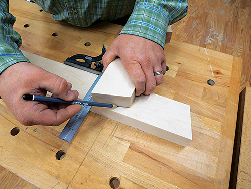 Marking angle for top portion of standing desk supports