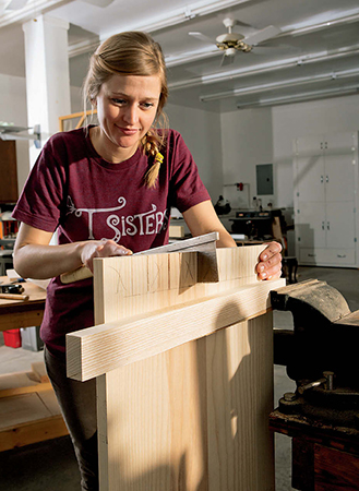 Saw the pins to shape, then chop the waste free using a backer board to align the chisel.