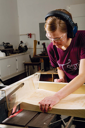 Cut the ends of the seat boards to length at the table saw. Back the cuts up either with a miter gauge and scrap fence or using a crosscut sled.