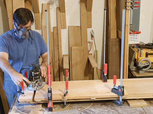 Routing second set of dadoes in bookcase side.