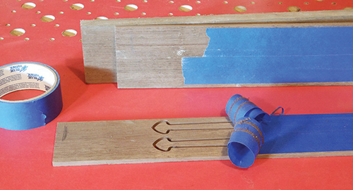 Securing spade inlays with tape to prevent loss or damage