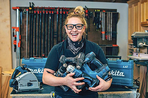 Stevie Estler holding drill driver collection