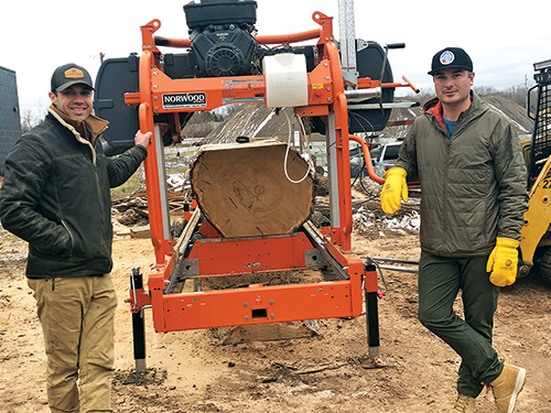 Storm Trees lumber company with tree and milling saw