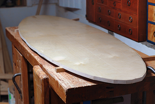 Rough cut surfboard-shaped tabletop