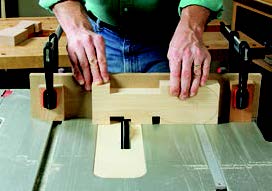 Cutting notches in pivoting mechanism with table saw