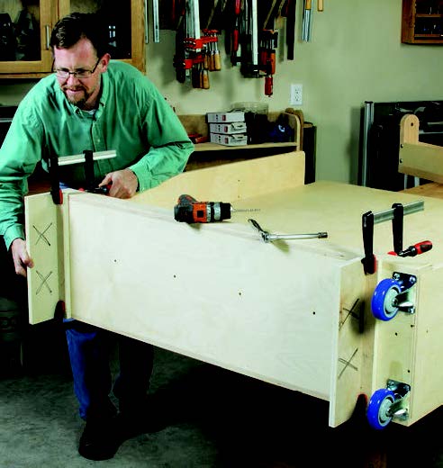 Using spacers to determine wall mount height for panel storage system