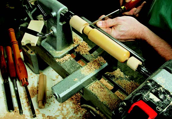 Turning panel storage spacer pegs on a lathe