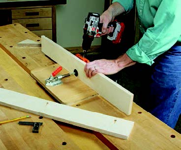 Drilling pocket holes in panel storage system side