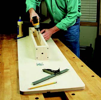 Assembling lumber storage system's side panel