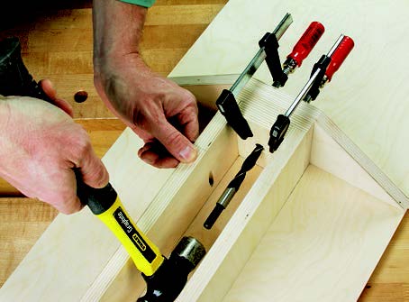 Marking position for pivot hole on swing-out panel storage unit