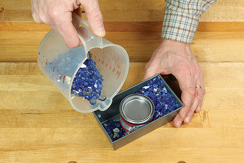 Filling tabletop fire pit pan with tempered glass shards
