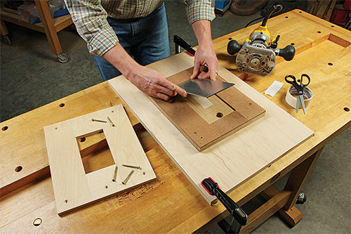 Test fitting aluminum strip on fireplace base