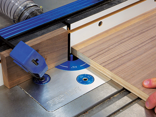 Cutting hinge mortises using stop block guide on router table