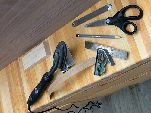 Tools for adding veneer strips to cabinet