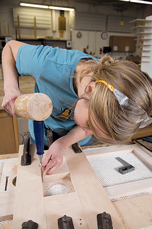 Cleaning rabbet corners with mallet and chisel