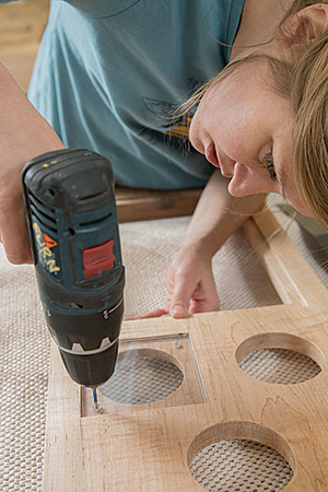 Installing glass backing panel on clock frame