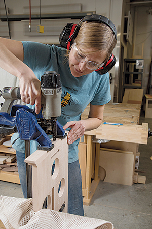 Mounting molding pieces on top section of clock frame