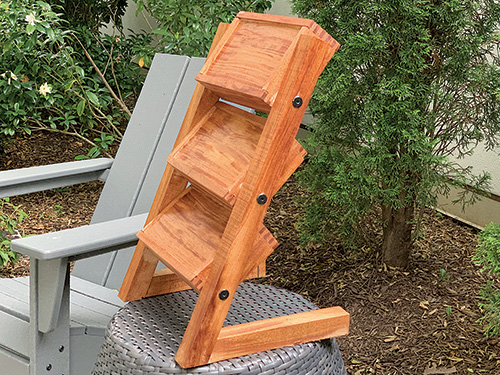 Tiered plant stand with shelving folded up