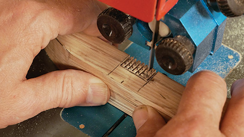 Cutting initial portion of half-lap joint on plant stand center support