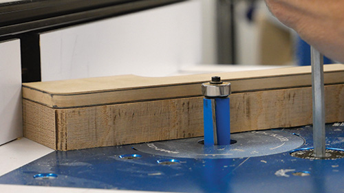 Using a template to guide a router cut on plant stand leg