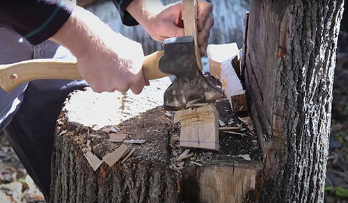 Rough cutting full spoon layout with axe