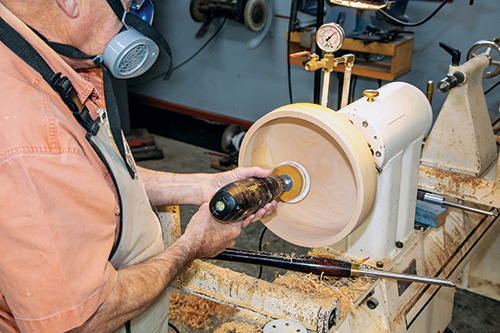 Sanding interior of calabash bowls