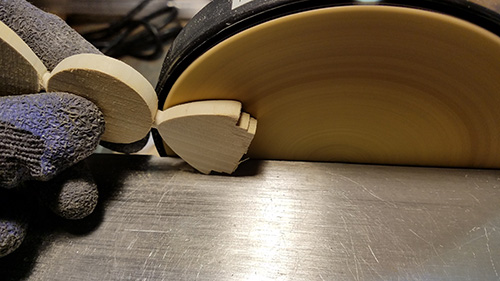 Sanding ornament turning with disc sander